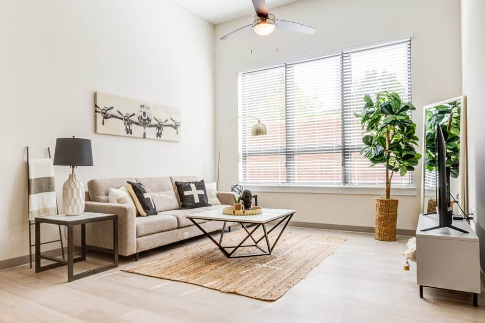 the nest at university center off campus apartments near winthrop university fully furnished living room with premium flooring